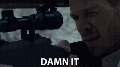 A Man Looking Through A Sniper Scope With The Words Damn It Above Him GIF
