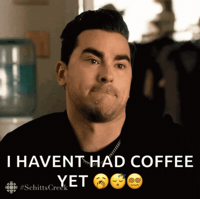 A Man Making A Face With The Words " I Haven T Had Coffee Yet " Next To Him GIF