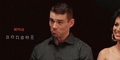 A Man Making A Funny Face In Front Of A Netflix Logo GIF