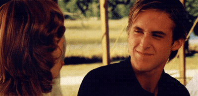A Man Making A Funny Face While Looking At A Woman GIF