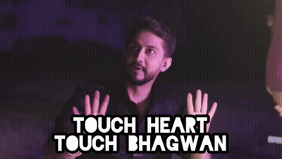 A Man Making A Funny Face With The Words Touch Heart Touch Bhagwan Above Him GIF