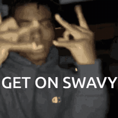 A Man Making A Peace Sign With His Hands And The Words Get On Swavy Written Below Him GIF