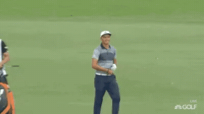 A Man Named Rickie Fowler Is Standing On A Green GIF