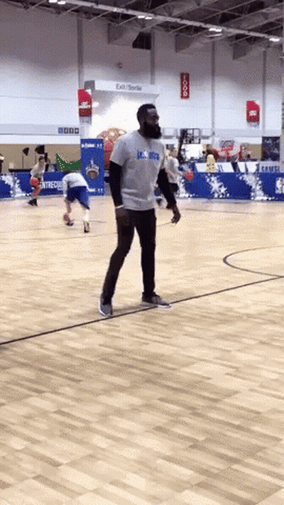 A Man On A Basketball Court Wearing A Shirt That Says Lsu Bruins GIF