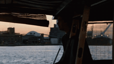 A Man On A Boat With The Words @Redqueentrinity Written On The Bottom GIF