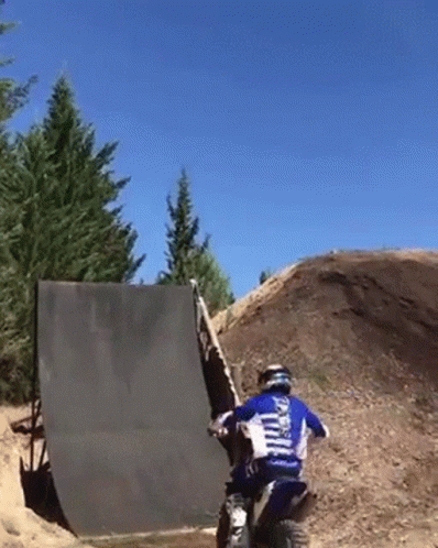 A Man On A Dirt Bike Wearing A Shirt That Says ' Yamaha ' On The Back Of It GIF