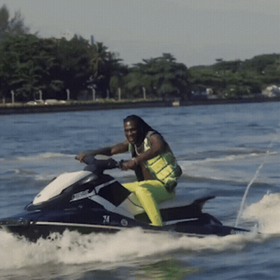 A Man On A Jet Ski With The Number 74 On It GIF