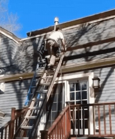 A Man On A Ladder Working On A Roof GIF