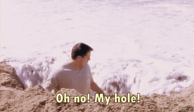 A Man On The Beach Says " Oh No! My Hole " GIF