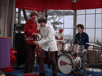 A Man Playing A Guitar Next To A Monkey Dbs Drum GIF