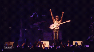 A Man Playing A Guitar On A Stage With The Name Steve Lacy GIF