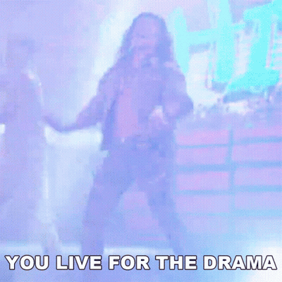 A Man Playing A Guitar On Stage With The Words " You Live For The Drama " Below Him GIF