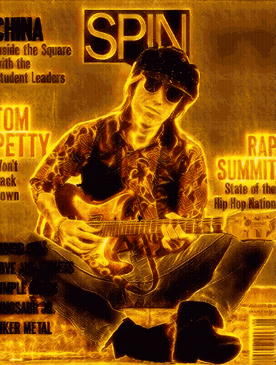 A Man Playing A Guitar On The Cover Of A Magazine Titled Spin GIF