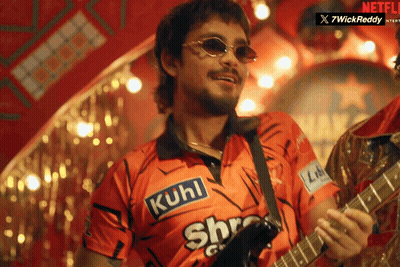 A Man Playing A Guitar With A Shirt That Says Kuhl On It GIF