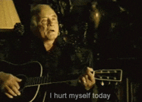 A Man Playing A Guitar With The Words " I Hurt Myself Today " Next To Him GIF