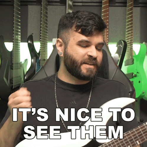 A Man Playing A Guitar With The Words It 'S Nice To See Them GIF