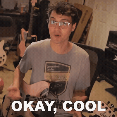 A Man Playing A Guitar With The Words Okay Cool Written Below Him GIF