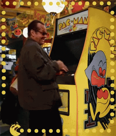 A Man Playing A Pac-Man Video Game GIF