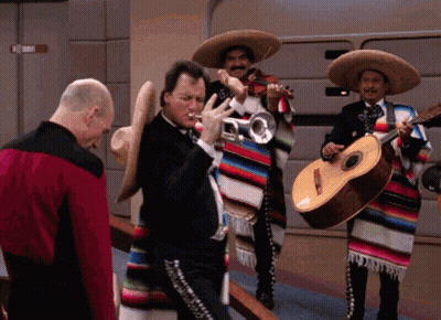 A Man Playing A Trumpet And A Man Playing Guitar GIF