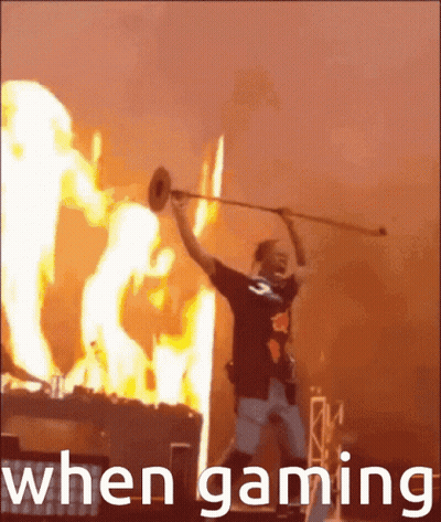 A Man Playing A Trumpet In Front Of A Fire With The Words " When Gaming " GIF