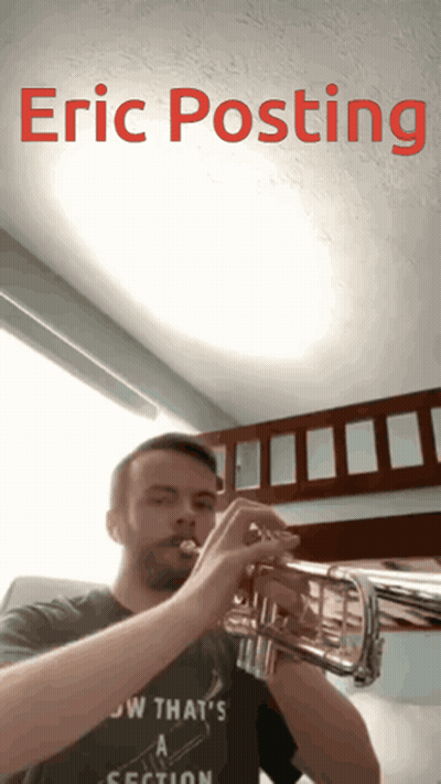A Man Playing A Trumpet With The Name Eric Posting Written Above Him GIF