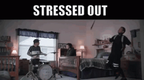 A Man Playing Drums In A Bedroom With The Words " Stressed Out " GIF
