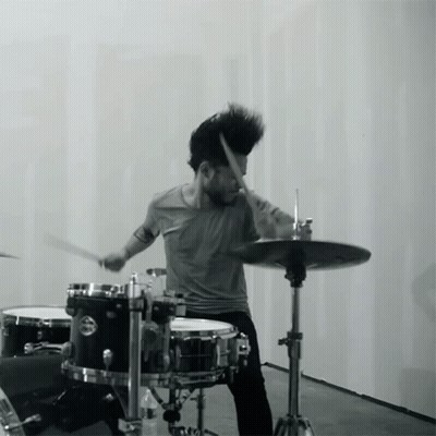 A Man Playing Drums With A Cymbal That Says ' Yamaha ' On It GIF