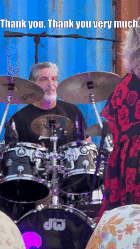 A Man Playing Drums With The Words Thank You Very Much Below Him GIF