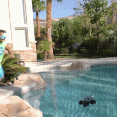 A Man Playing With A Remote Control Car In A Swimming Pool GIF