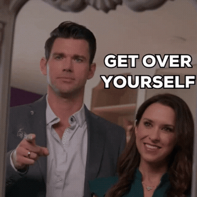 A Man Pointing At A Woman With The Words Get Over Yourself GIF