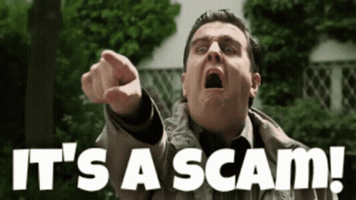 A Man Pointing At The Camera With The Words It 'S A Scam Behind Him GIF