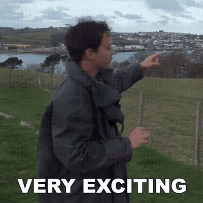 A Man Pointing In A Field With The Words Very Exciting Written Below Him GIF