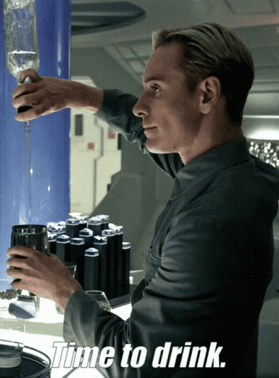 A Man Pouring A Drink Into A Glass With The Words Time To Drink Above Him GIF