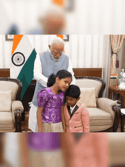 A Man Putting A Purple Shirt On A Little Girl GIF