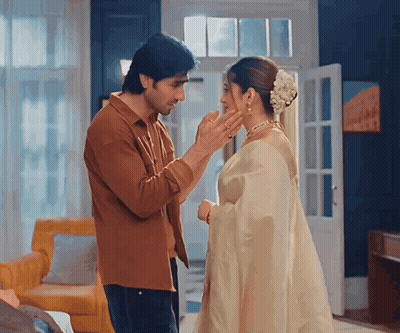 A Man Putting A Ring On A Woman 'S Nose GIF