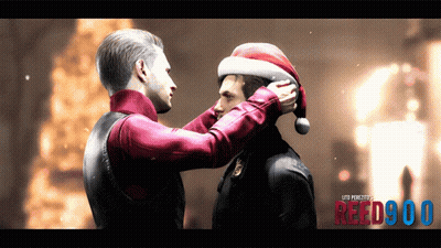 A Man Putting A Santa Hat On Another Man 'S Head With Reed900 Written On The Bottom Right GIF