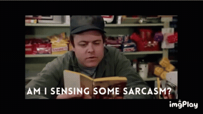 A Man Reading A Book With The Words Am I Sensing Some Sarcasm On The Bottom GIF
