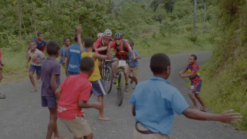 A Man Riding A Bike With A Number 1 On The Back GIF