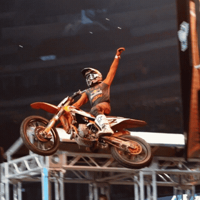 A Man Riding A Dirt Bike With The Number 2 On The Back GIF