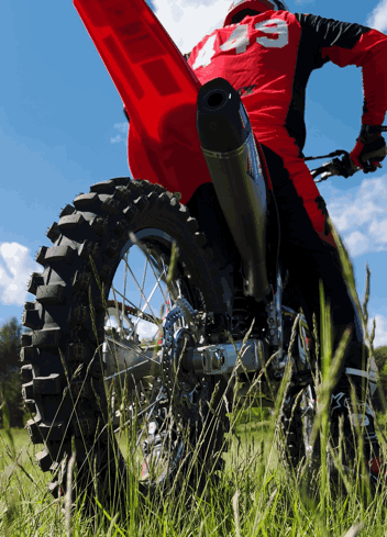 A Man Riding A Dirt Bike With The Number 43 On His Shirt GIF