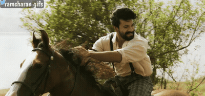 A Man Riding A Horse With Ramcharan Gifs Written In The Corner GIF