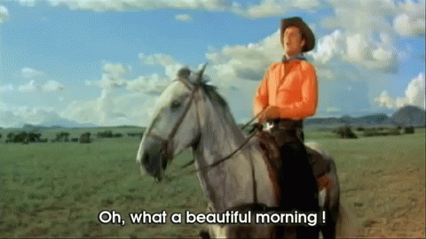 A Man Riding A Horse With The Words Oh What A Beautiful Morning GIF