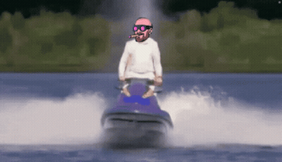 A Man Riding A Jet Ski In The Water With A Cigar In His Mouth GIF