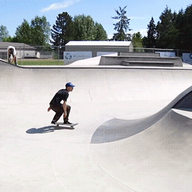 A Man Riding A Skateboard In A Skate Park GIF