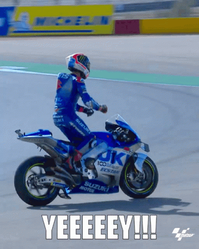 A Man Riding A Suzuki Motorcycle On A Track With The Caption Yeeeeey GIF