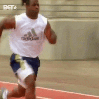 A Man Running On A Track Wearing A White Adidas Tank Top GIF