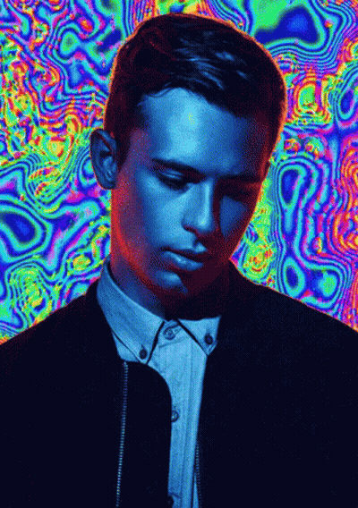 A Man 'S Face Is Against A Colorful Background GIF