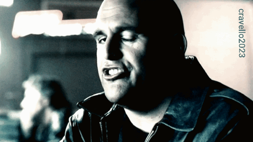 A Man 'S Face Is Shown In A Black And White Photo With The Number Crallo2023 On The Bottom Right GIF