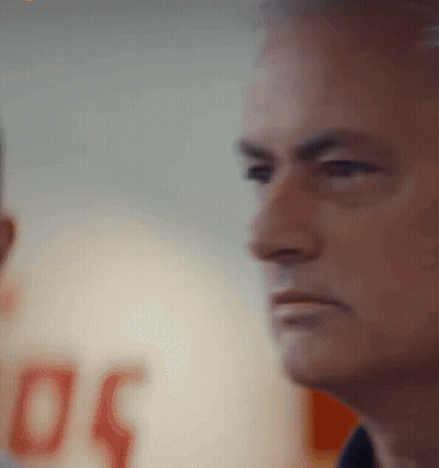 A Man 'S Face Is Shown In A Blurry Photo With The Number 50 In The Background GIF