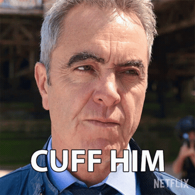 A Man 'S Face Is Shown With The Words " Cuff Him " Above Him GIF